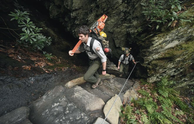 Park rangers climb the staircase at the Chimney Tops trail in the Great Smoky Mountains National Park.