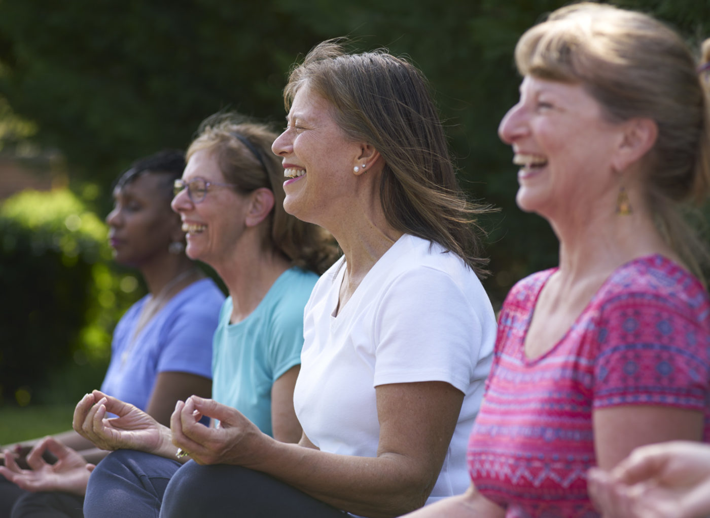 Women sit in a meditation circle.