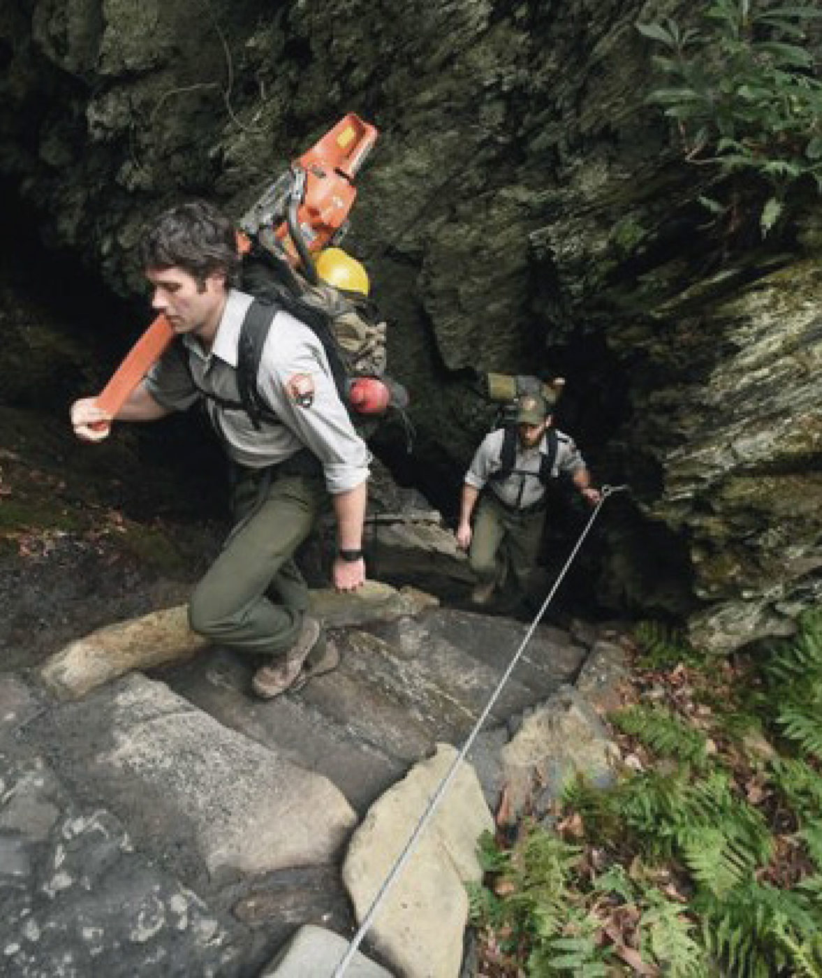 Park rangers climb the staircase at the Chimney Tops trail in the Great Smoky Mountains National Park.