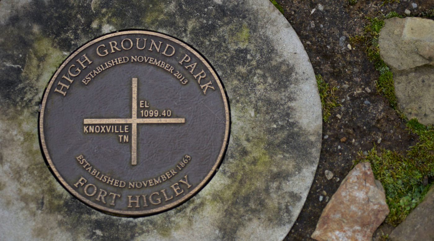 A photo of a geographical survey marker at High Ground Park.